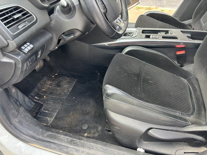 Driver seat and floor before detailing